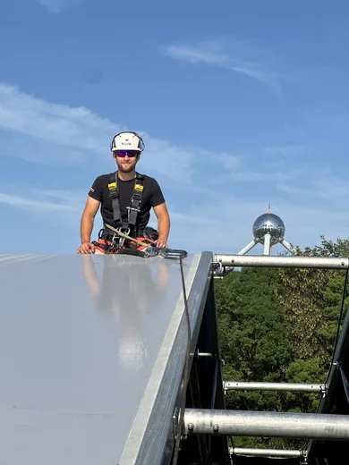 On the roof ridge with the Atomium behind