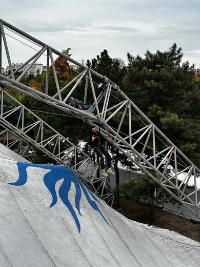 On the canvas roof of the big top