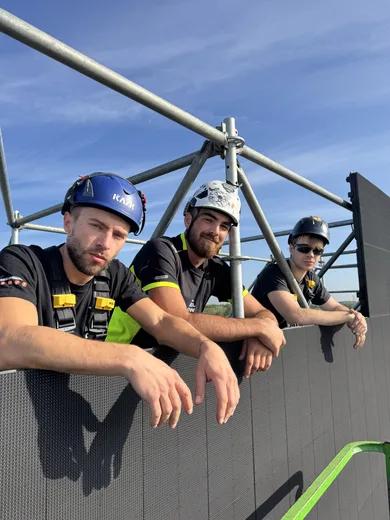 Three of the crew on top of the LED wall