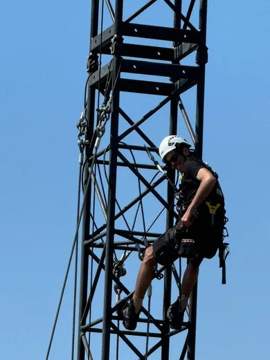 Rigger on a truss tower